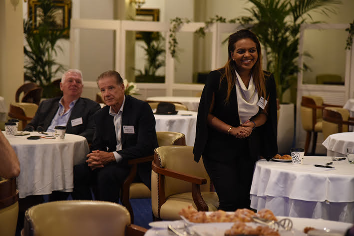 CBD Roundtable Series - Person smiling at seated guests